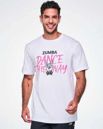 A male model wearing a white short-sleeve crewneck tee with a pink and black graphic that reads 'ZUMBA DANCE THIS WAY.' 