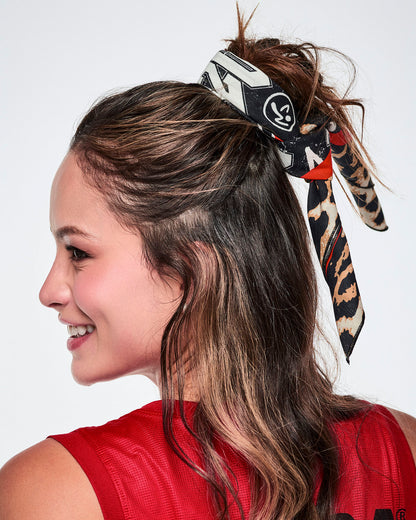 Close-up of a female model wearing a bandana as a hair tie.