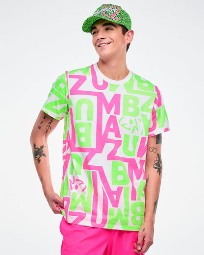 Male model wearing a Zumba green and black leopard print hat, bright green and pink and white graphic tee and pink pants.