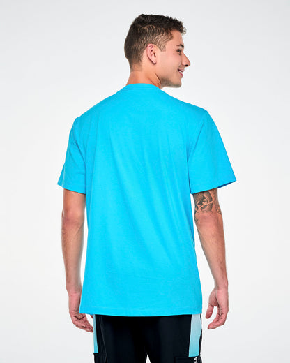 Shown from the back, a male model in the blue 'ZUMBA' Smurf face tee, with a plain back and short sleeves.