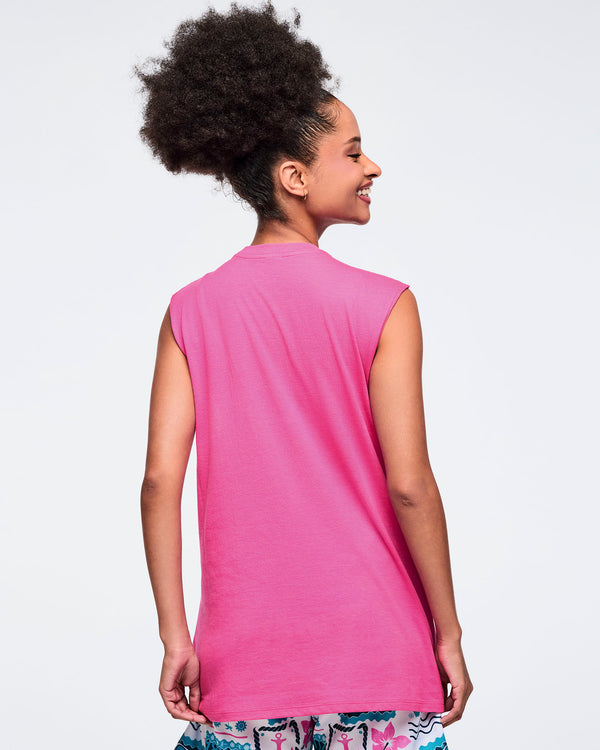 Back view of a female model wearing a pink sleeveless top.