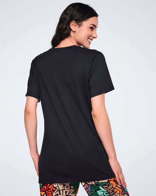 Back view of a black short-sleeve T-shirt with a crew neckline, straight hem, and relaxed fit. Female model wears the T-shirt with multicolor print leggings.
