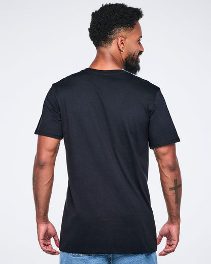 Back view of a male model wearing a black t-shirt on a white background.