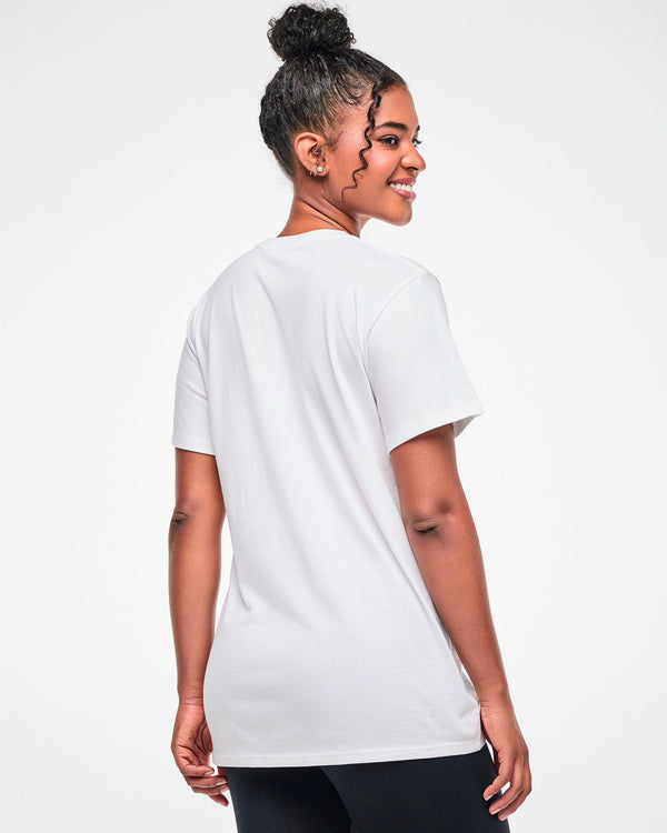 Shown from the back, female model wearing a white tee.