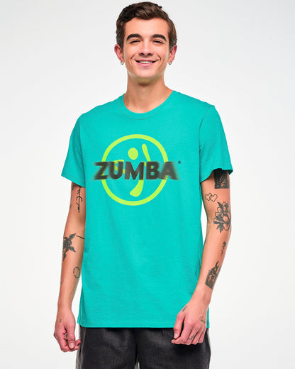 Male model wearing an aqua tee with a yellow Zumbito logo and halftone black dot "ZUMBA" text.