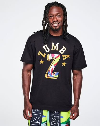 Male model wearing a black Zumba t-shirt with colorful design on a white background.