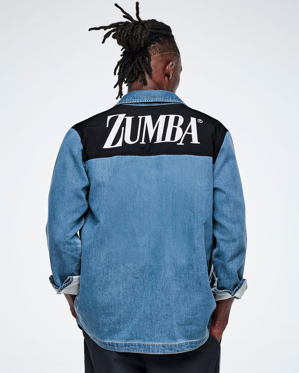 Back view of a male model wearing a denim shacket with a black yoke featuring white 