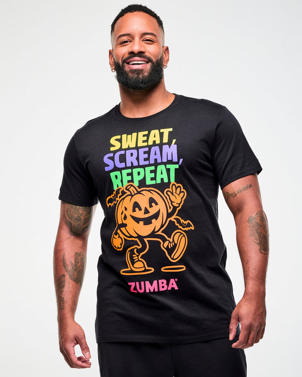 Male model wearing a black graphic tee with a colorful 
